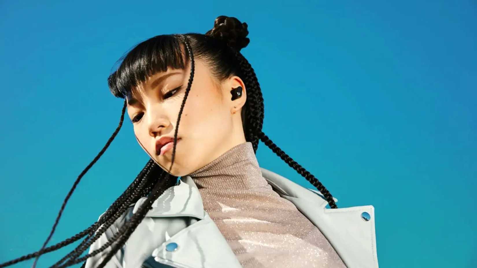 Person wearing studio beats earbuds.