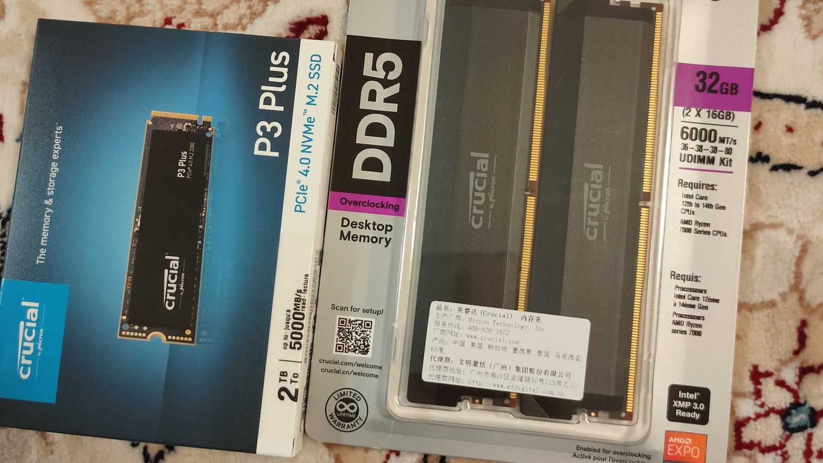Crucial DDR5 RAM and an M.2 NVMe in their original packaging.