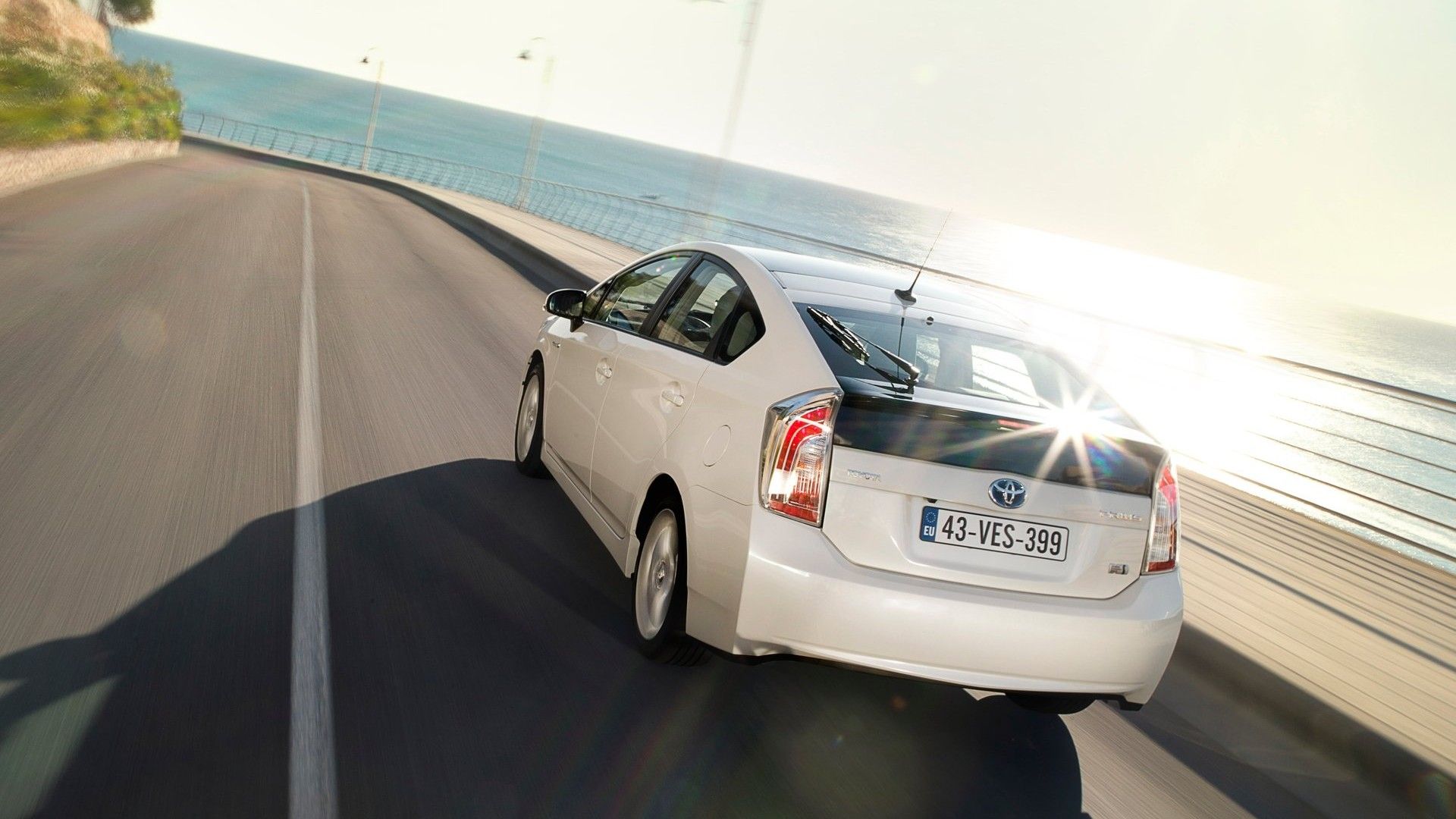 Rear 3/4 action shot of a 2012 Toyota Prius
