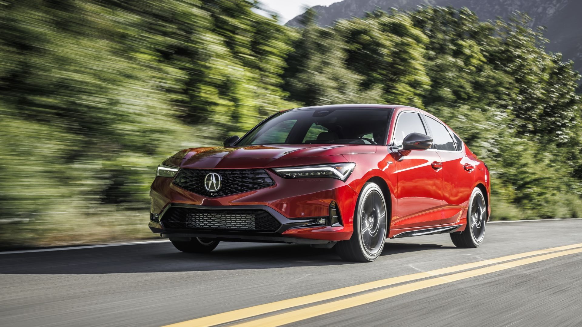 Front 3/4 action shot of a 2023 Acura Integra