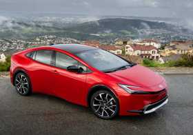 The 2025 Prius Prime XSE in Supersonic Red offers plug-in hybrid efficiency on regular fuel