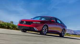 Front 3/4 action shot of a 2023 Honda Accord