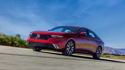 Front 3/4 action shot of a 2023 Honda Accord