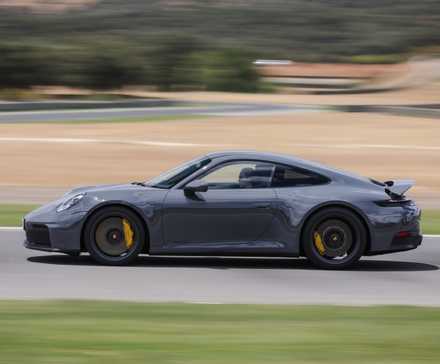 Side profile action shot of a 2025 Porsche 911 Carrera GTS