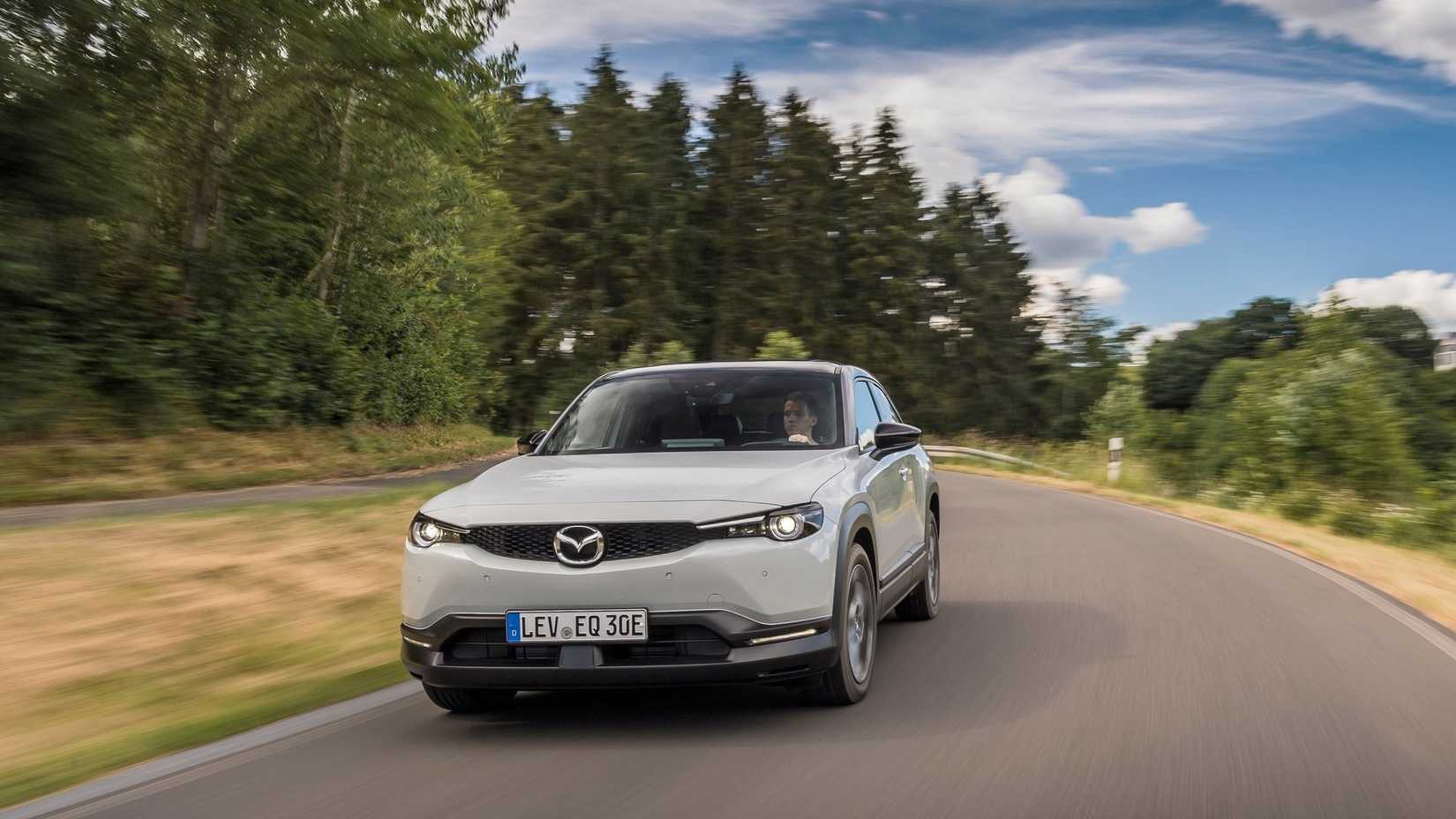 Front 3/4 action shot of a 2022 Mazda MX-30