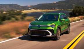 Front 3/4 action shot of a 2025 Volkswagen Taos