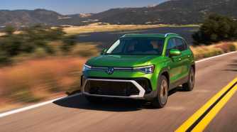 Front 3/4 action shot of a 2025 Volkswagen Taos