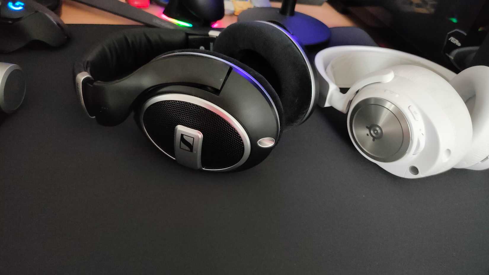Sennheiser HD 599 SE open-back headphones next to the SteelSeries Arctis Nova Pro Wireless closed-back headset.