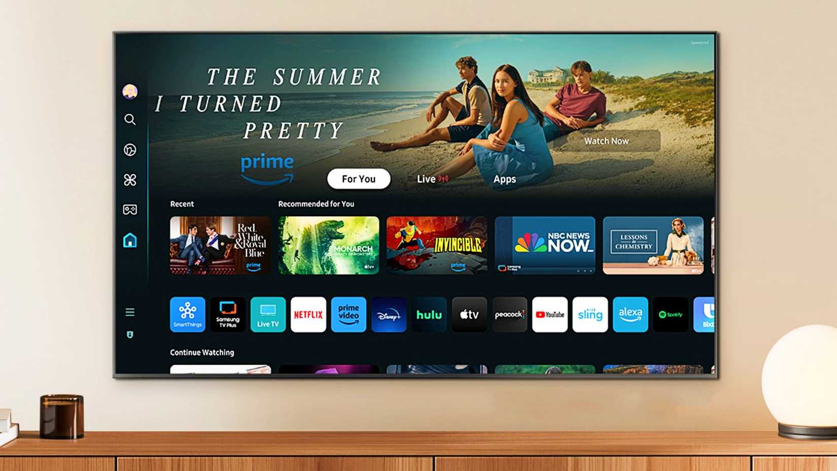 Samsung S85D 55-inch OLED smart TV on a wall.