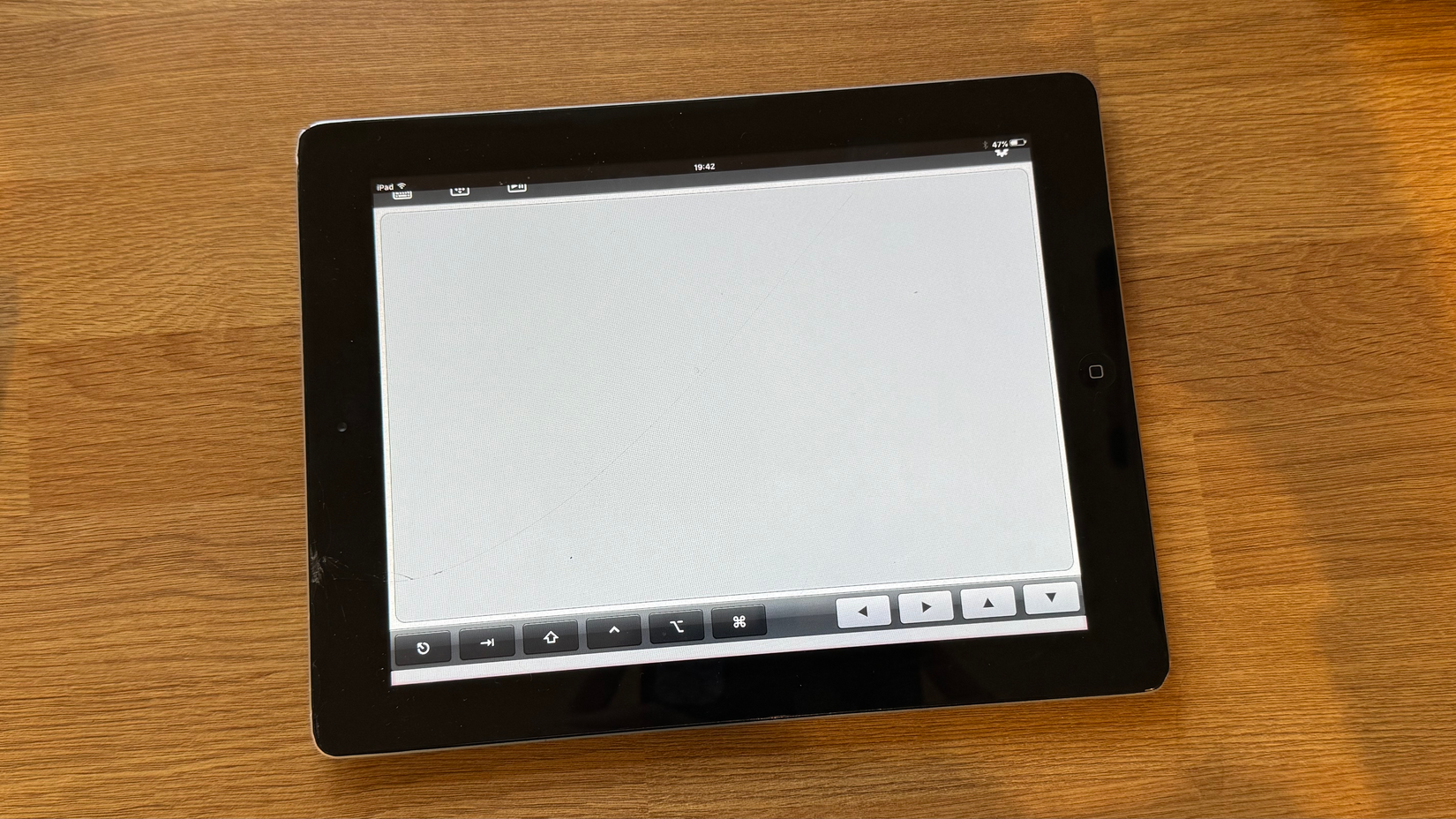The Touchpad app running on a battered iPad 2.
