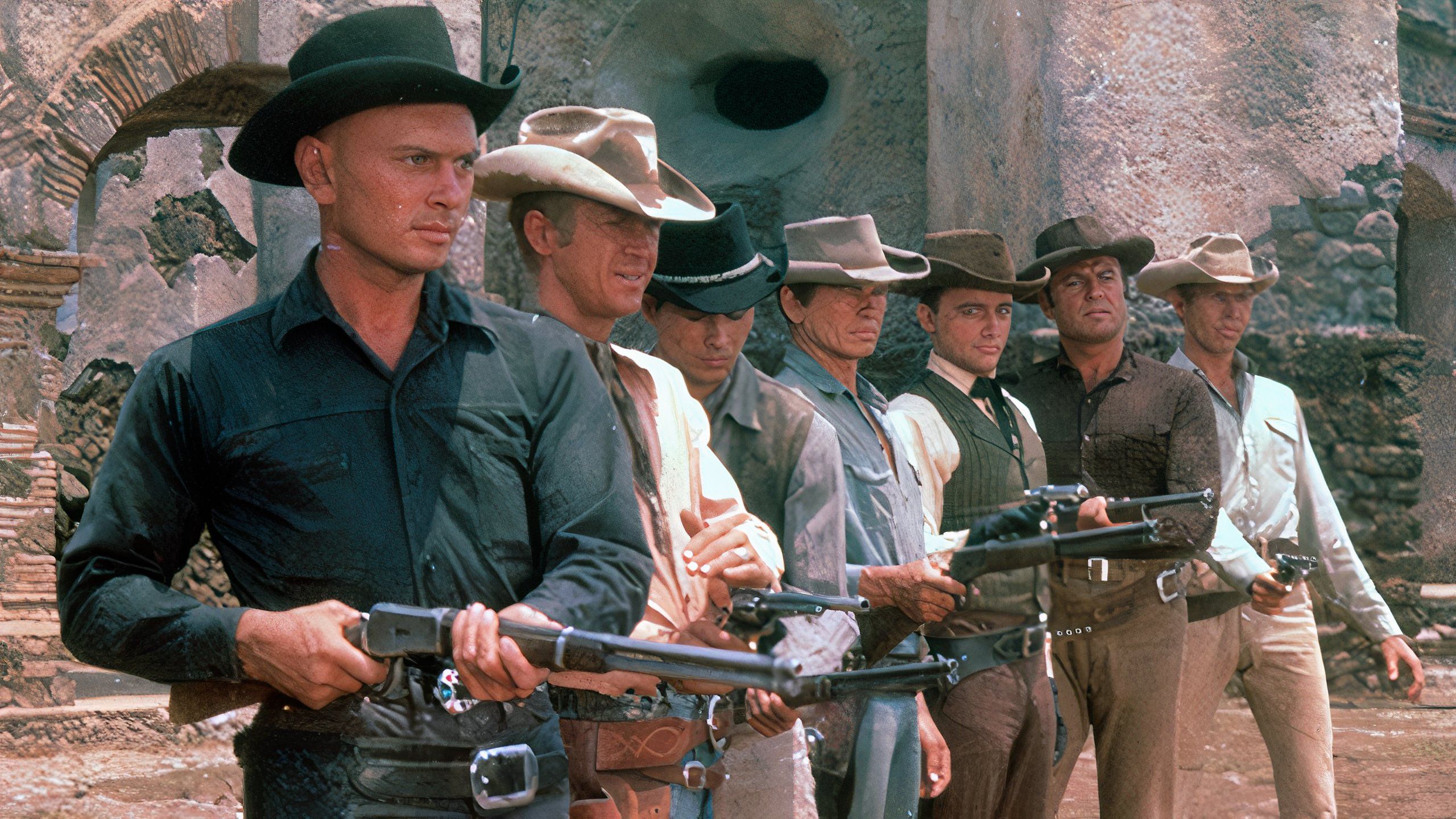 Seven gunslingers standing next to each other with guns from The Magnificent Seven