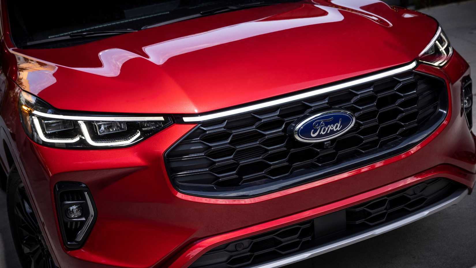 Close-up shot of the frotn grille on a red 2023 Ford Escape ST-Line Elite.