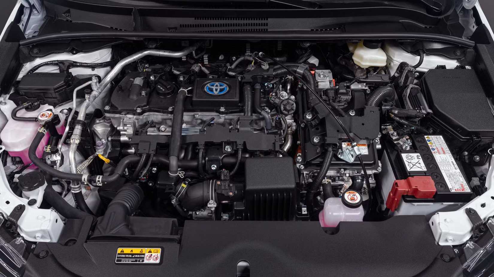 Close-up shot of the engine bay of a 2023 Toyota Corolla Hybrid.