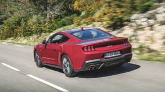 Rear 3/4 action shot of a 2024 Ford Mustang