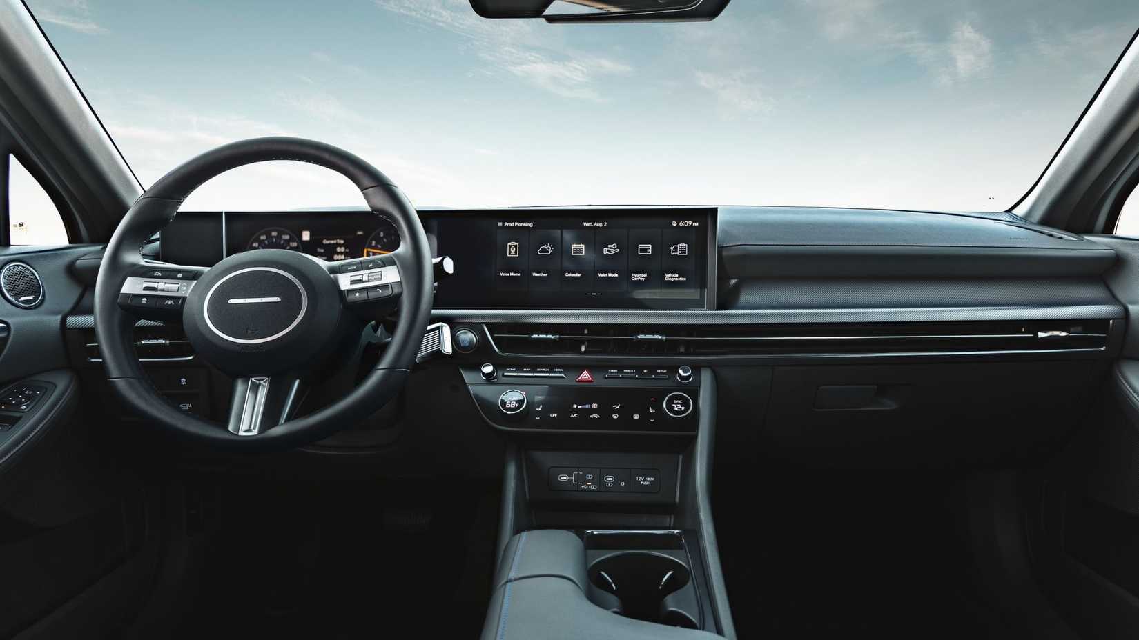 Close-up shot of the dashboard in a 2025 Hyundai Sonata Hybrid Limited, showing the steering wheel and infotainment screen.