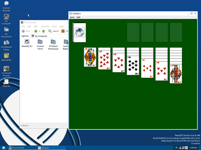 ReactOS desktop with Explorer and solitaire.
