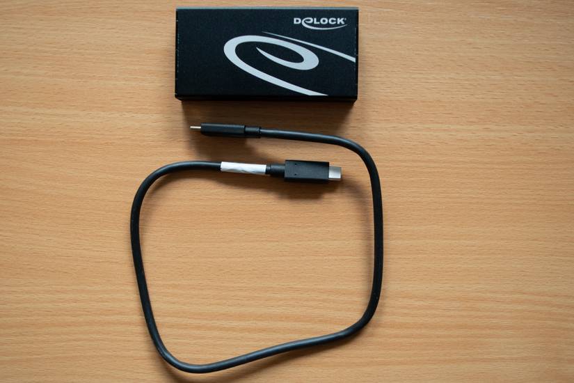 A DIY External SSD based on a Samsung 980 Pro lying on top of a desk. 