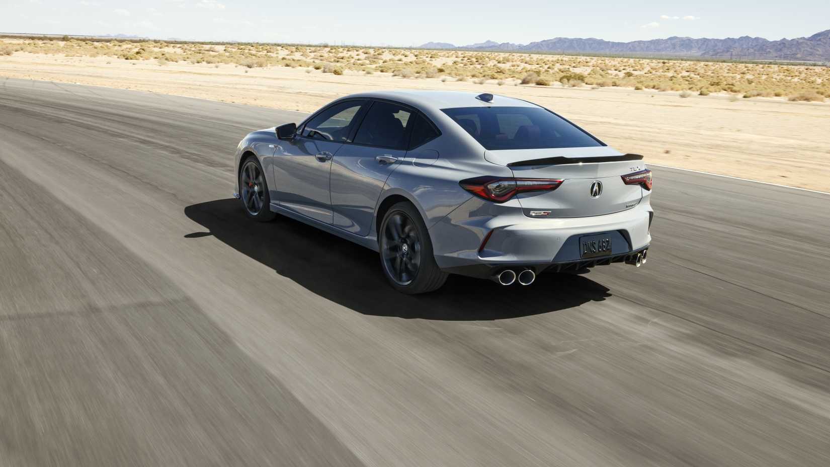 Rear 3/4 action shot of a 2024 Acura TLX Type S
