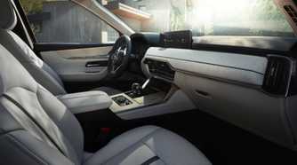 Shot inside the cabin of a 2026 Mazda CX-90 showing the interior.