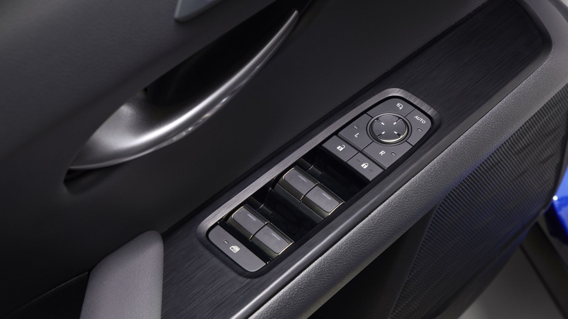 Shot of the window controls in the door of a 2025 Lexus UX