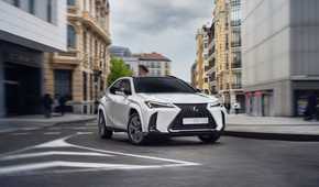 Front 3/4 action shot of a 2025 Lexus UX