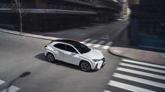 Front 3/4 action shot of a 2025 Lexus UX