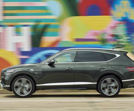 Side-profile action shot of a 2025 Genesis GV80
