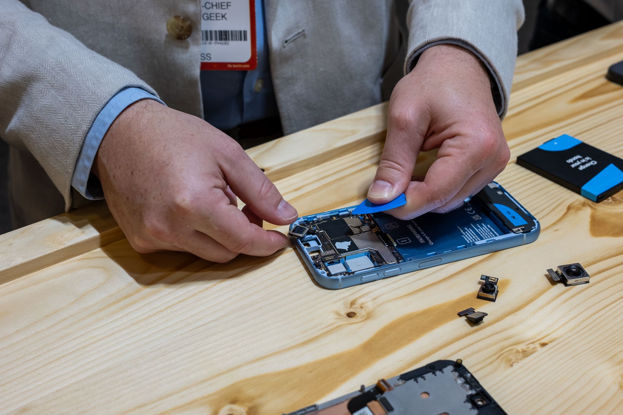 Person disassembling the Fairphone 5 at IFA 2023