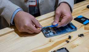 Person disassembling the Fairphone 5 at IFA 2023