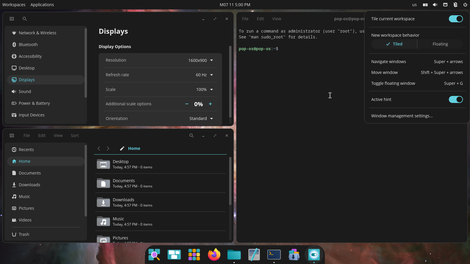 Cosmic desktop environment auto-tiling functionality with three windows.