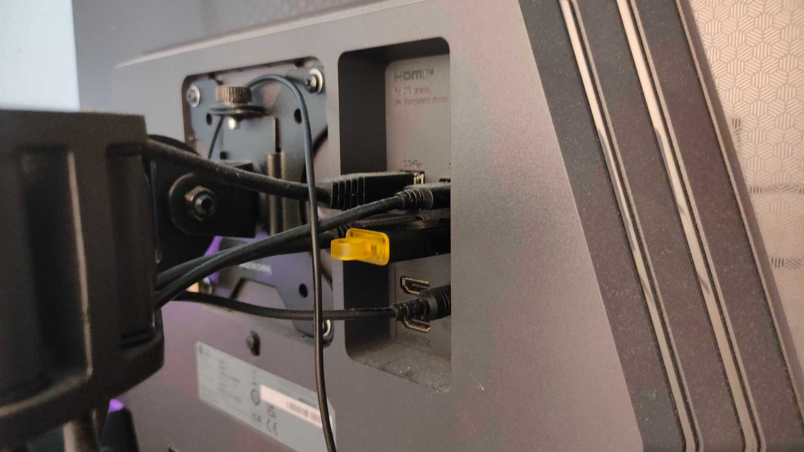 A USB flash drive plugged into a monitor.