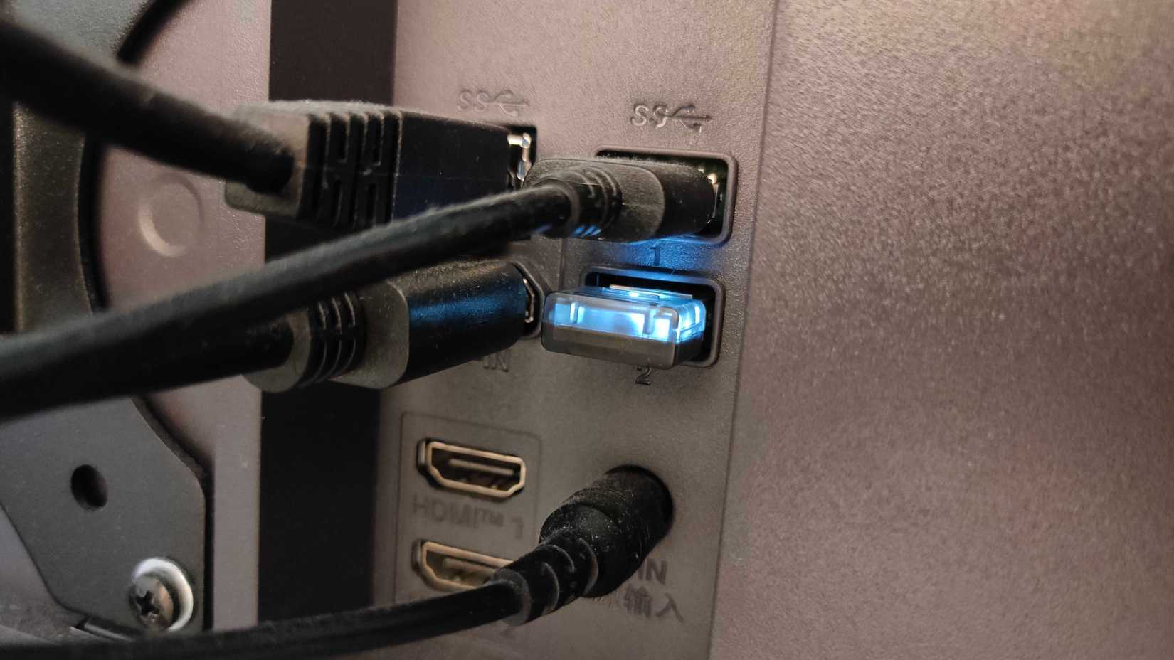 A 2.4GHz dongle plugged into a monitor.