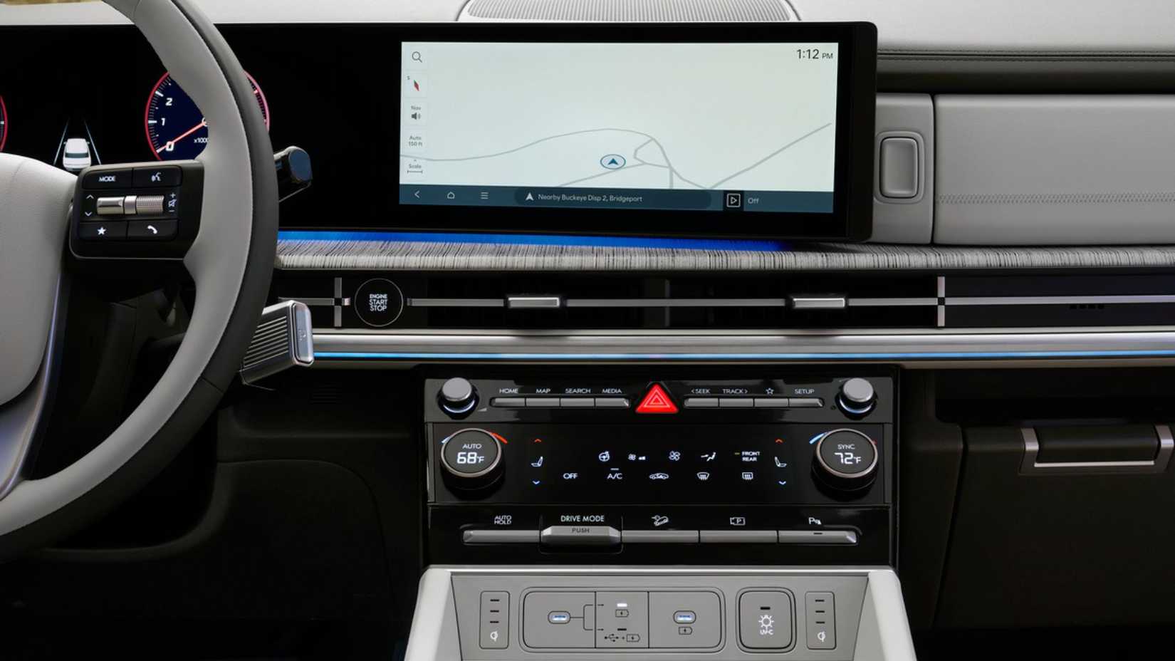 A close-up of the dashboard in the 2025 Hyundai Santa Fe Hybrid, showing the infotainment screen and driver controls.
