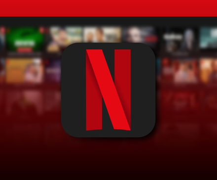 Netflix logo centered on a dark gradient background, with a blurred grid of shows and movies behind it.