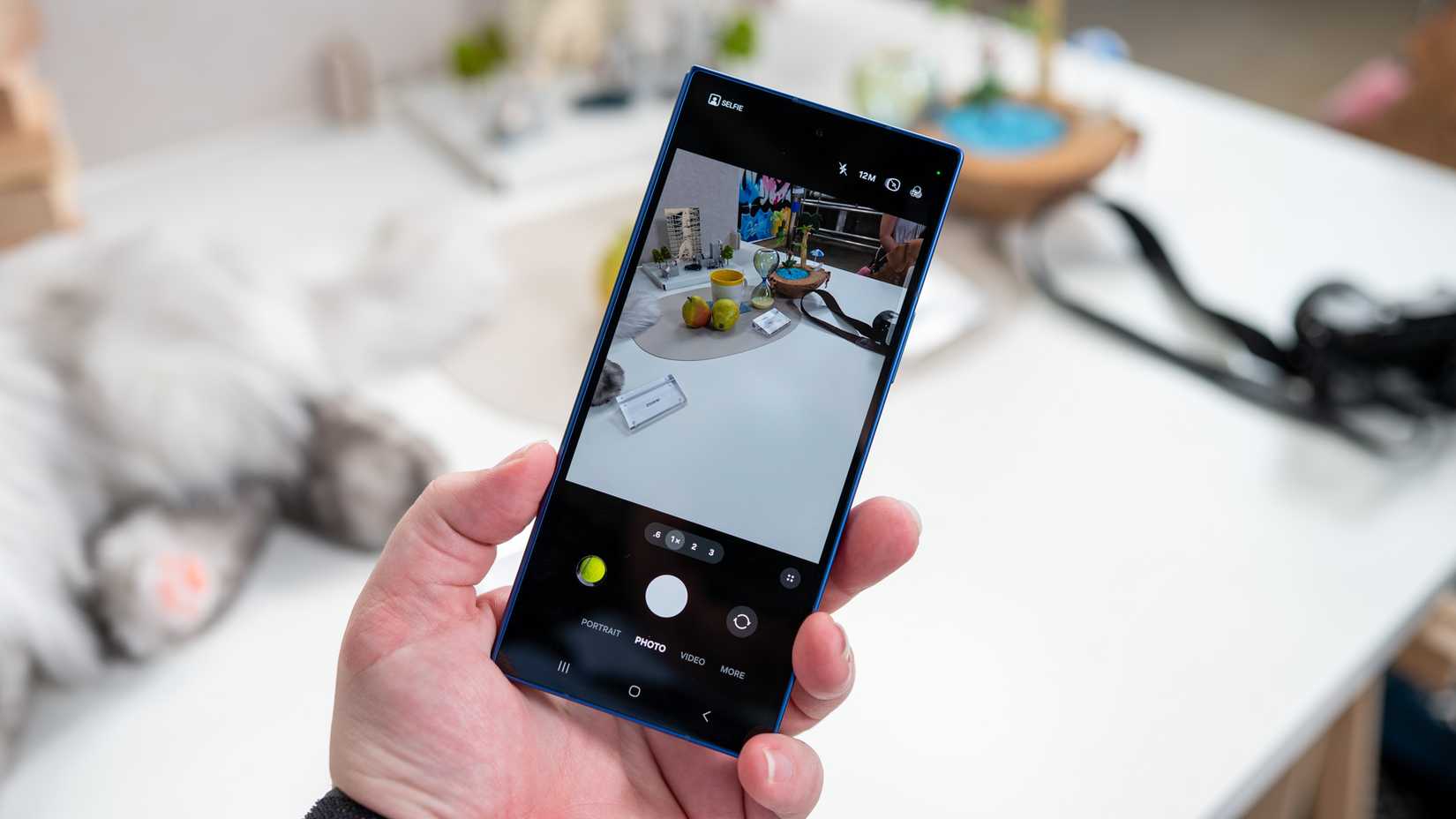 person holding the samsung galaxy z fold 7 folded showing the camera app 54642055656 o