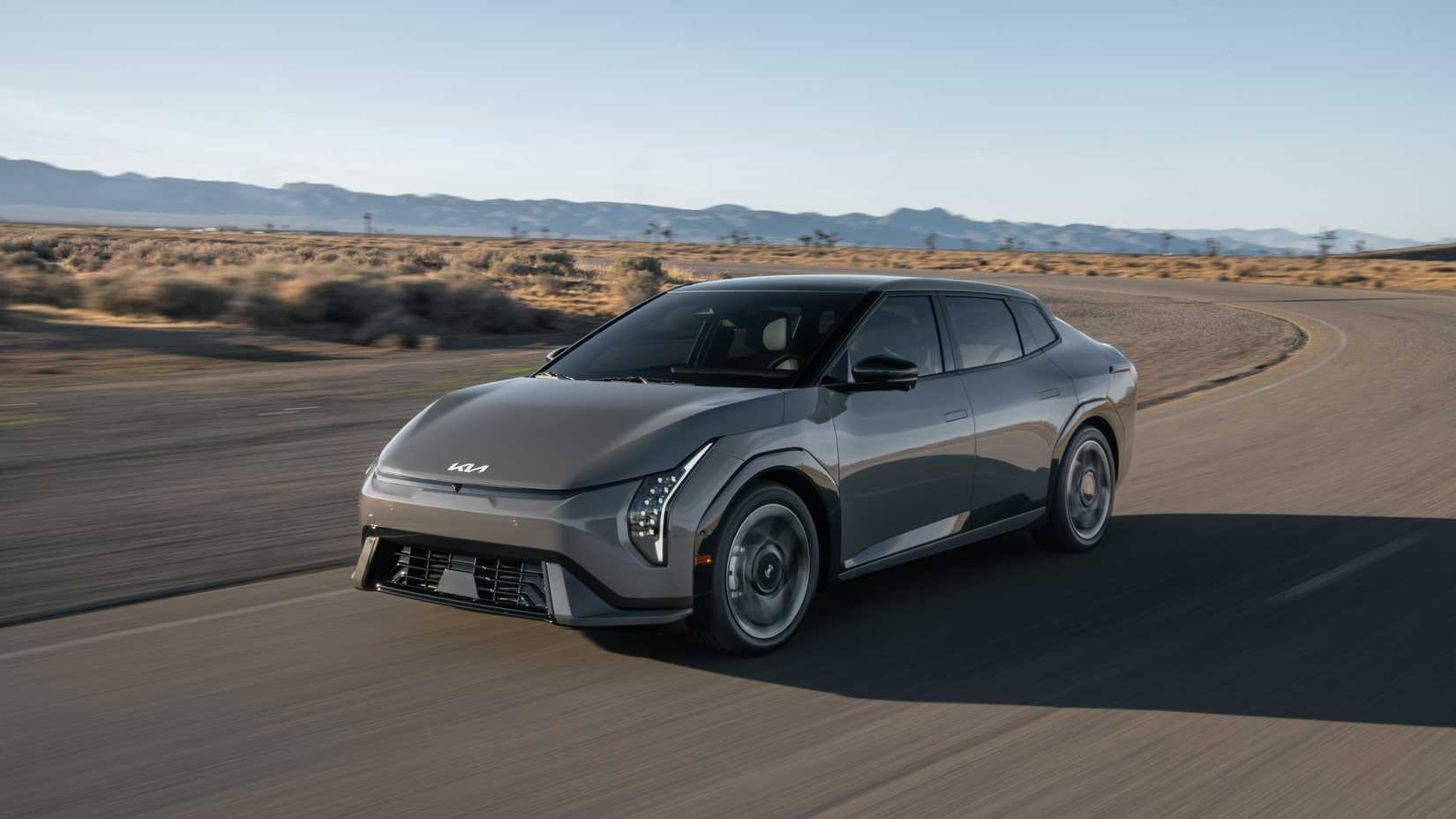 Front 3/4 action shot of a 2026 Kia EV4