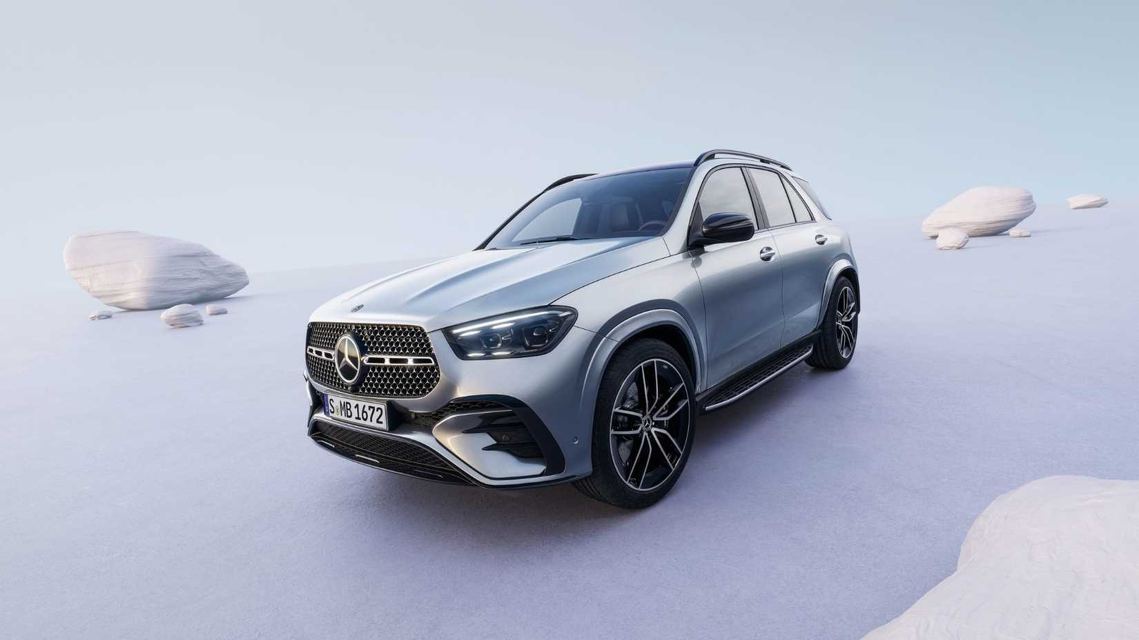 Static front 3/4 shot of a silver 2023 Mercedes-Benz GLE in a studio setting.