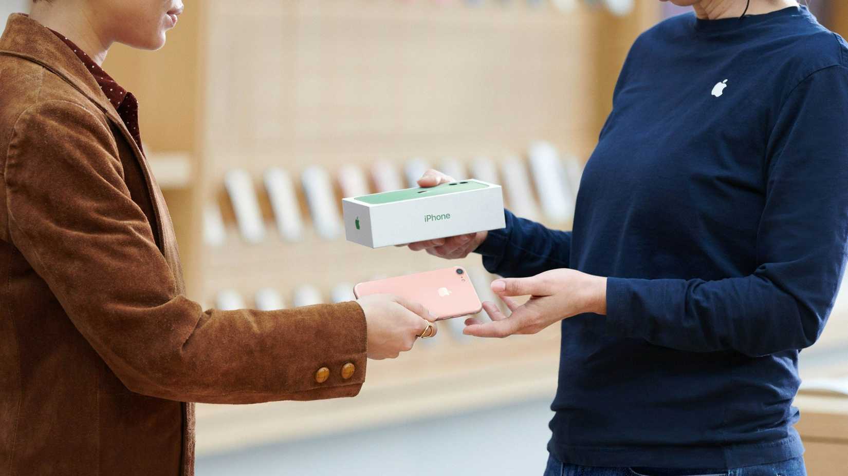 Customer trading in their iPhone for a new one at the Apple store.