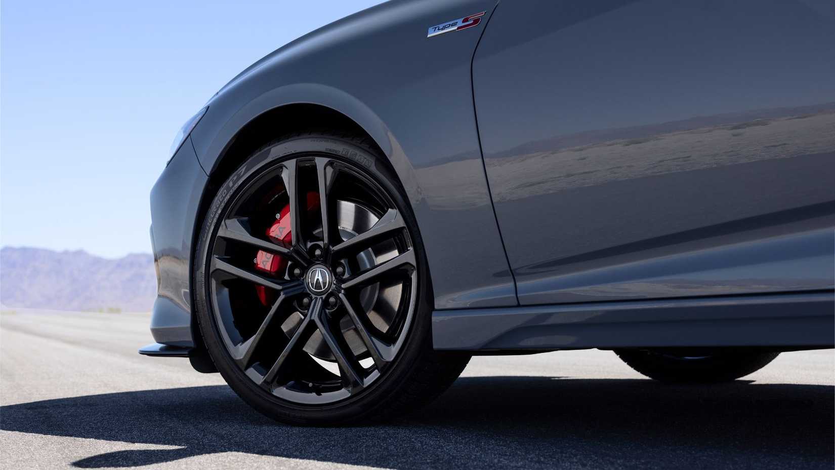 Close-up shot of the alloy wheel of a gray 2024 Acura TLX Type S.