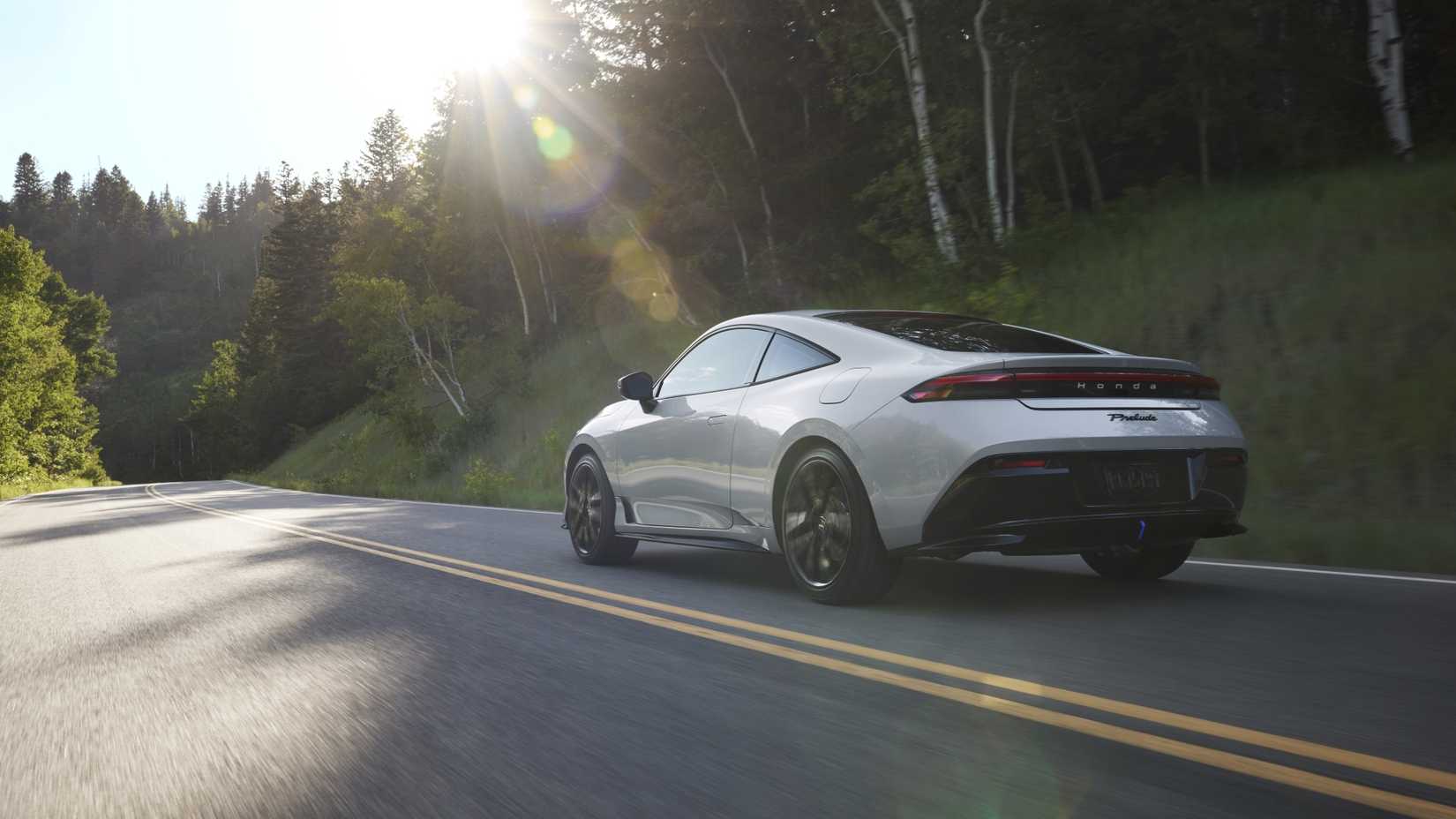 Rear 3/4 action shot of a 2026 Honda Prelude