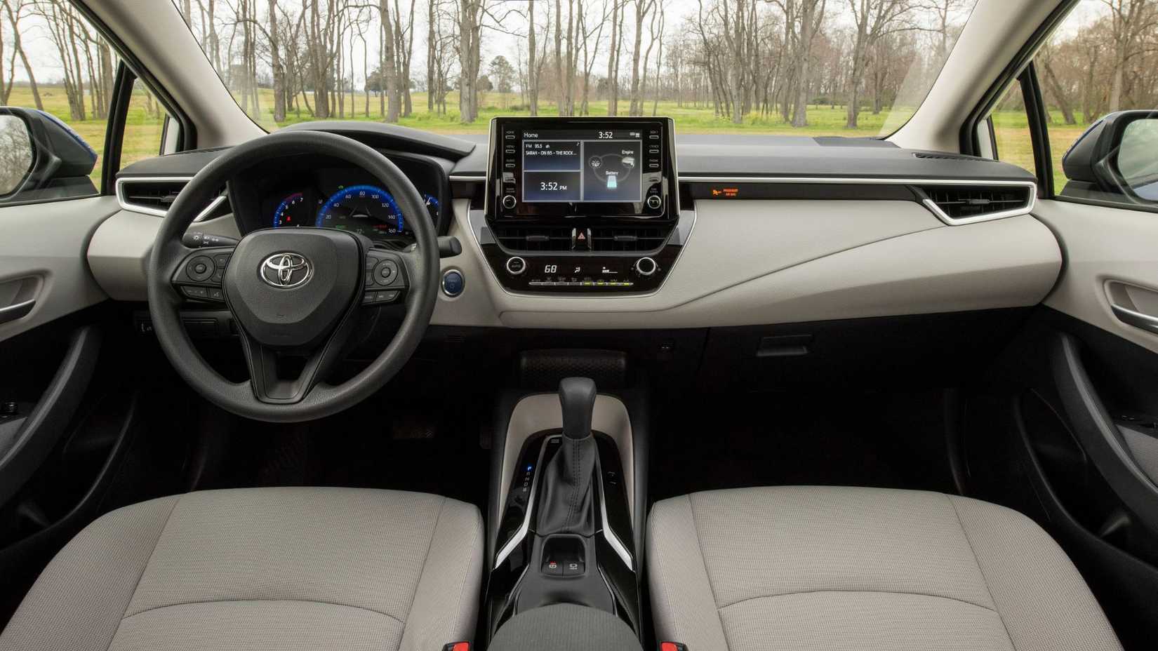 Shot inside the cabin of a 2022 Toyota Corolla Hybrid showing the front seats and dashboard.