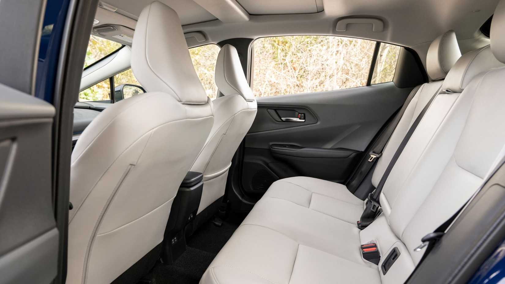 Shot inside the cabin of a 2024 Toyota Prius Limited showing the rear seats.