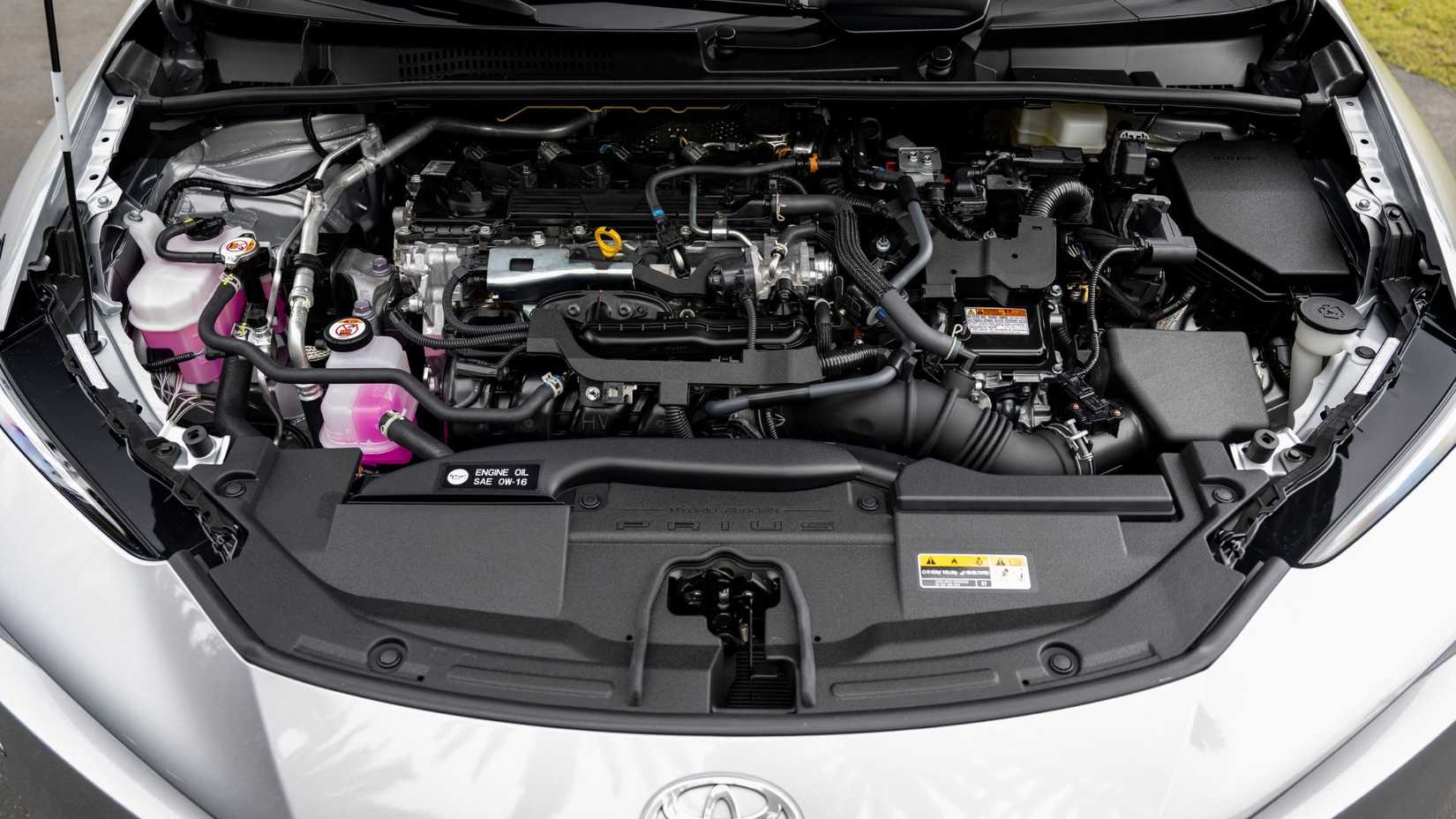 Close-up shot under the hood of a 2024 Toyota Prius XLE.