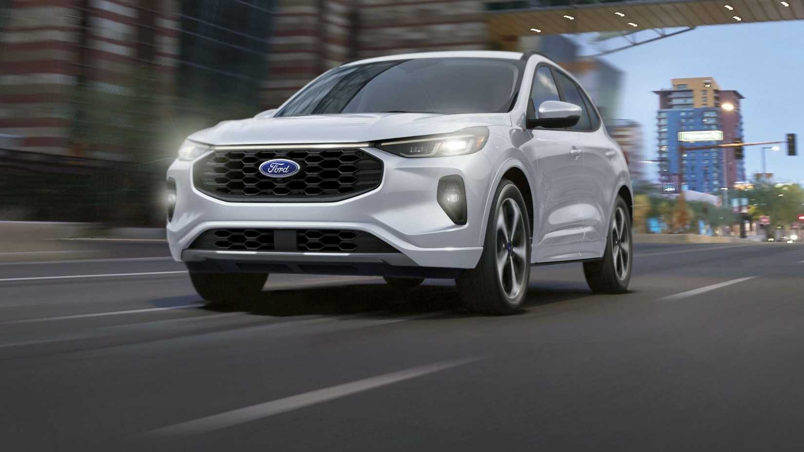 Dynamic front 3/4 shot of a white 2025 Ford Escape ST-Line Elite driving in a city.
