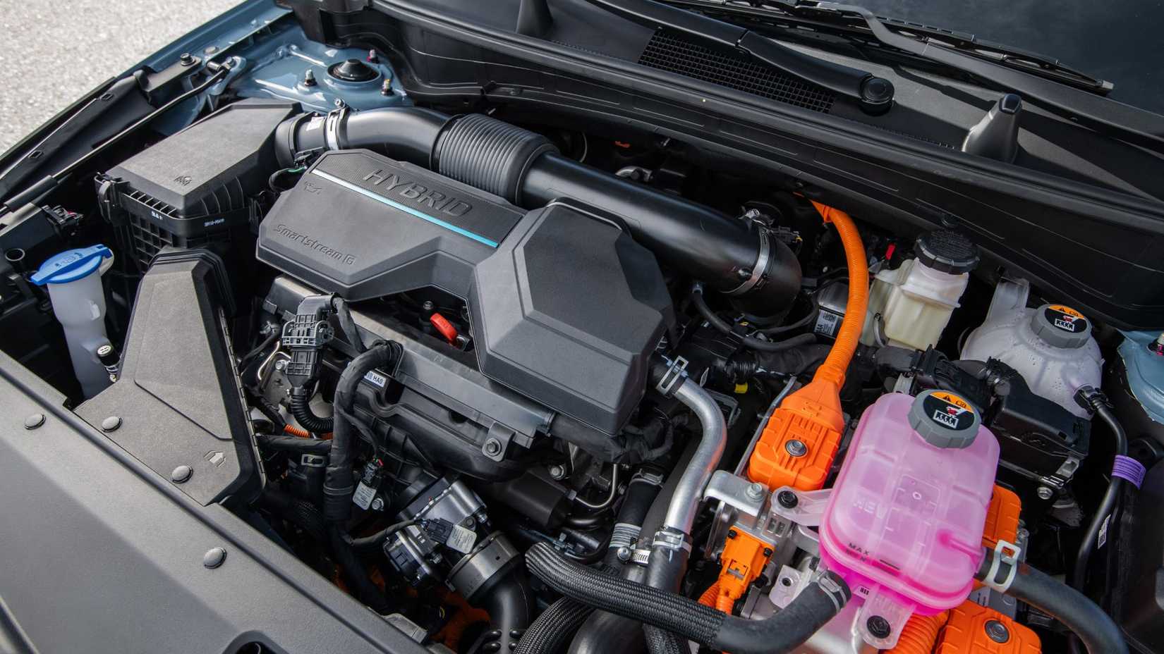 Close-up under the hood of a 2026 Kia Sportage HEV.