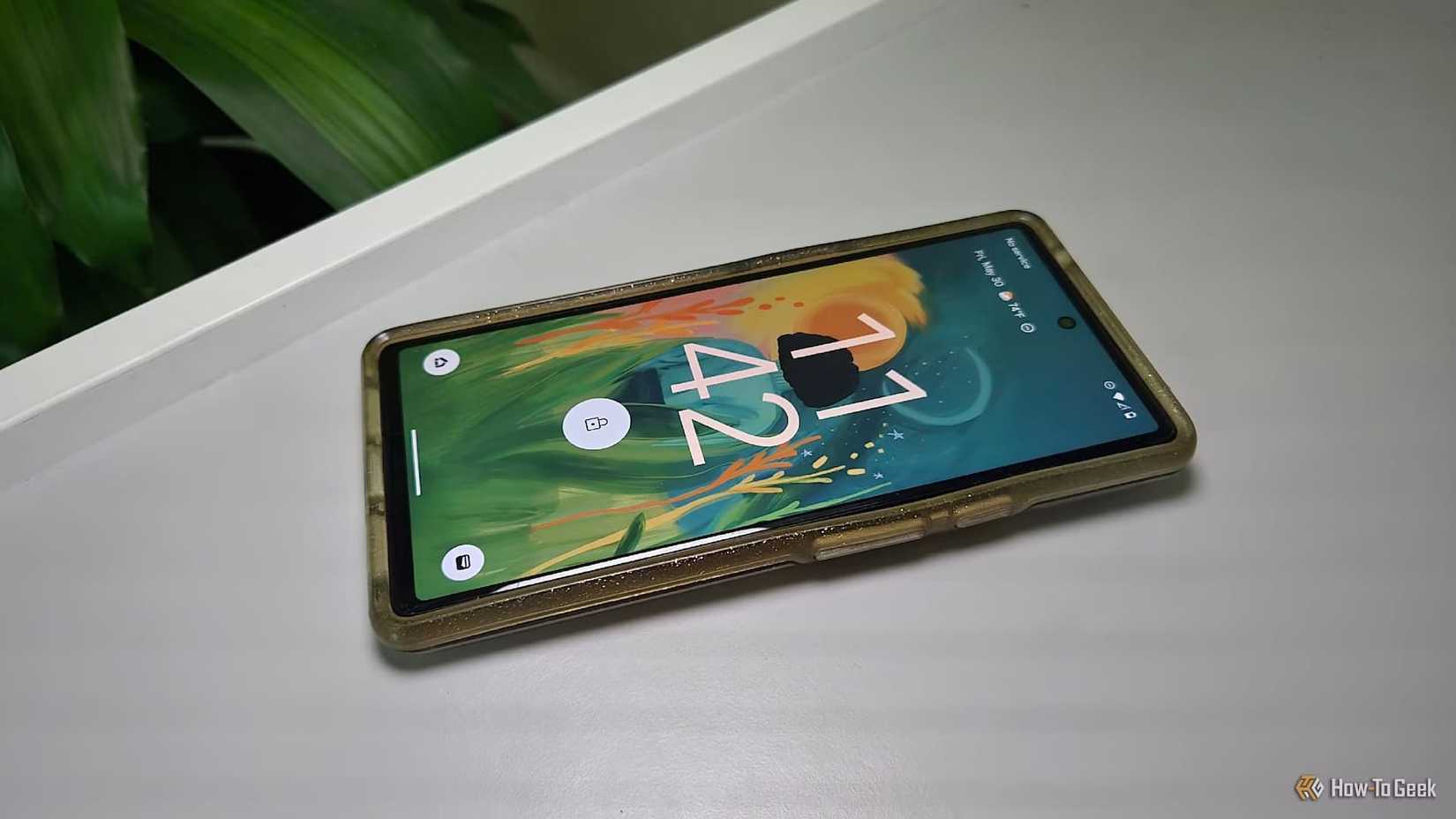 A Google Pixel 6 in a case on a desk.