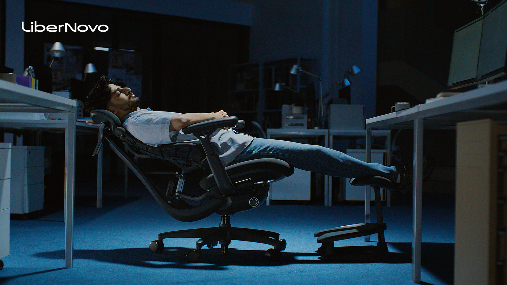 A man fully reclines in a LiberNovo Omni.
