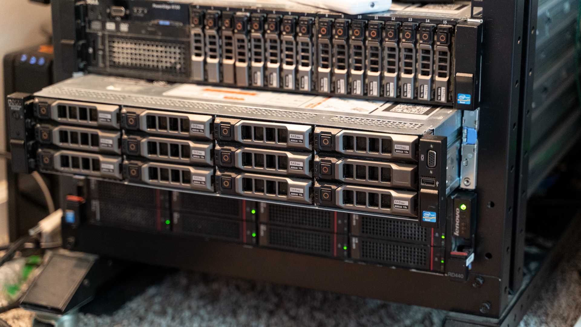 A rack-mount server slid out of the rack slightly with other servers above and below it.