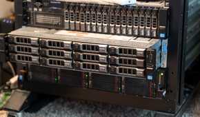 A rack-mount server slid out of the rack slightly with other servers above and below it.