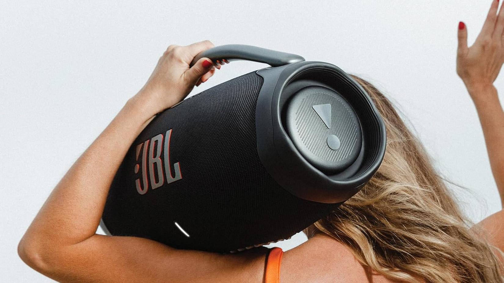 Person holding the JBL Boombox 3 on their shoulder.